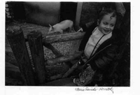 Child with pigs at Turtleback Zoo